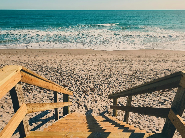 stairs on beach and ocean in background