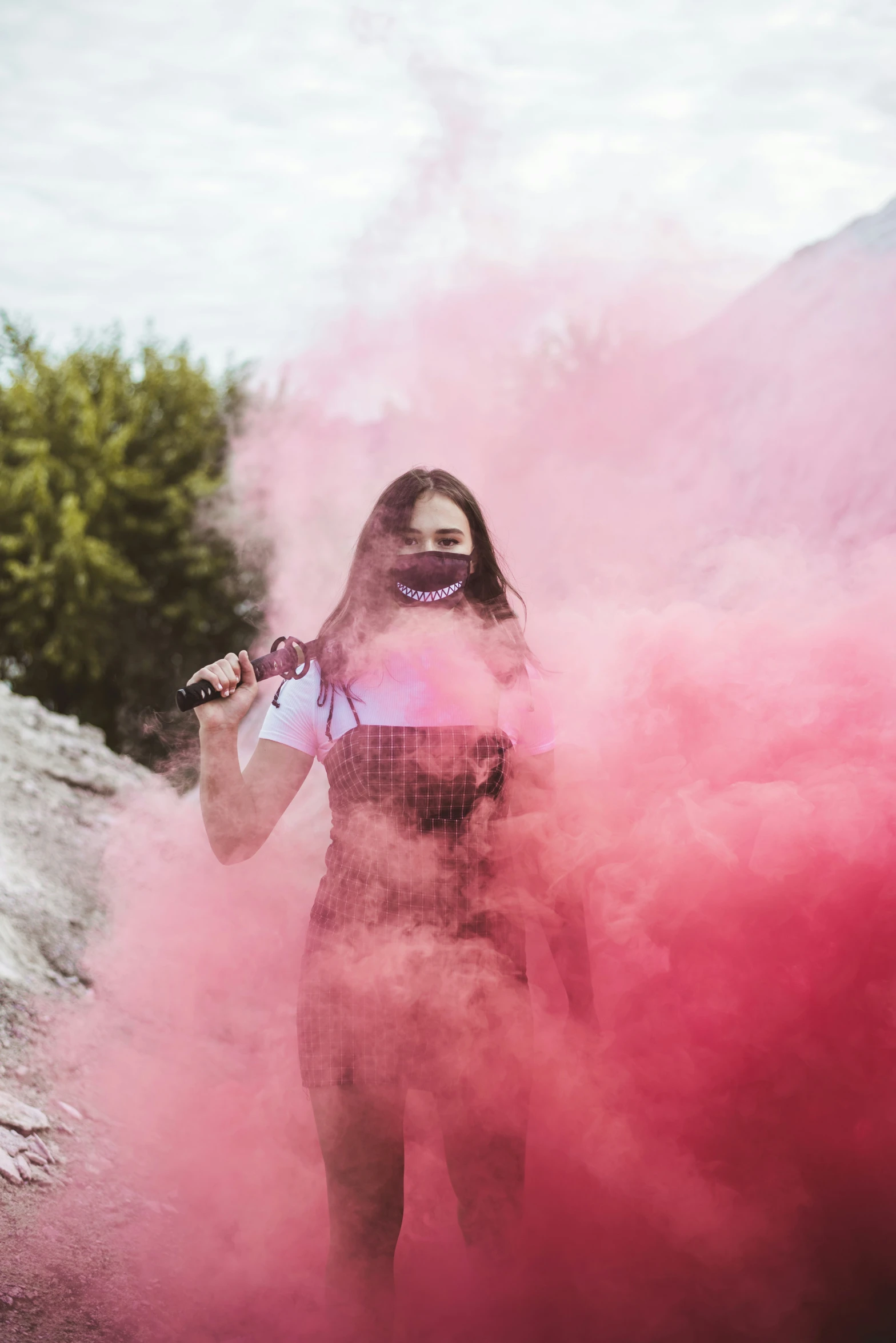 a woman with smoke coming from her mouth