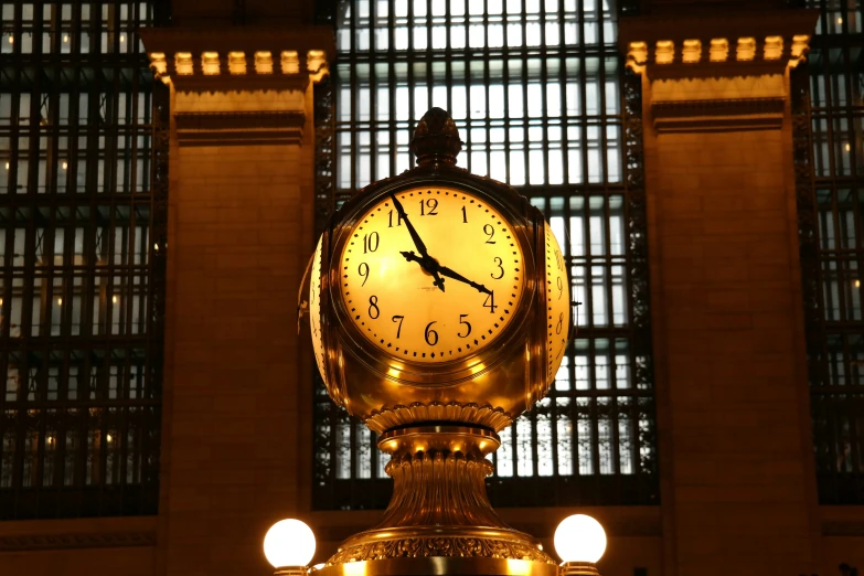 large clock on the outside of the train station