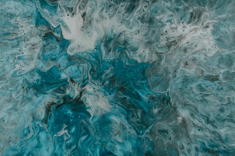 a blue and black surface that looks like abstract painting