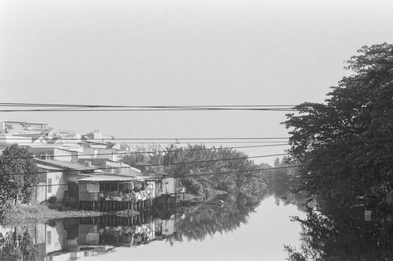 a street with houses on the other side of water