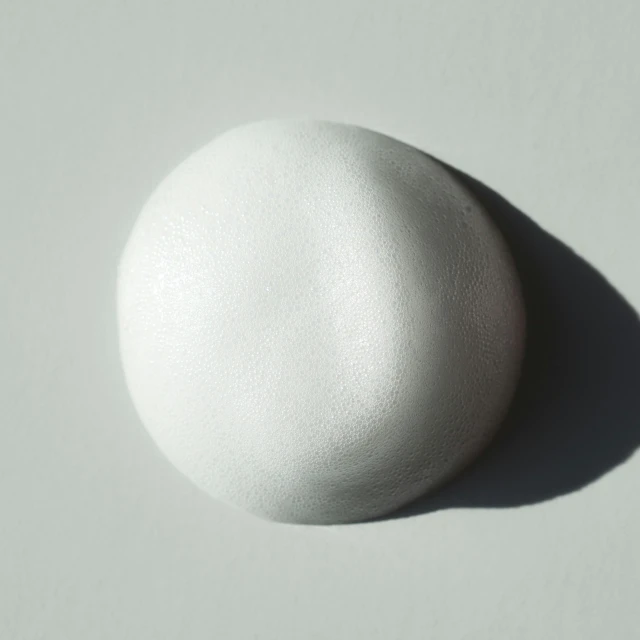 an egg is pictured on a white table