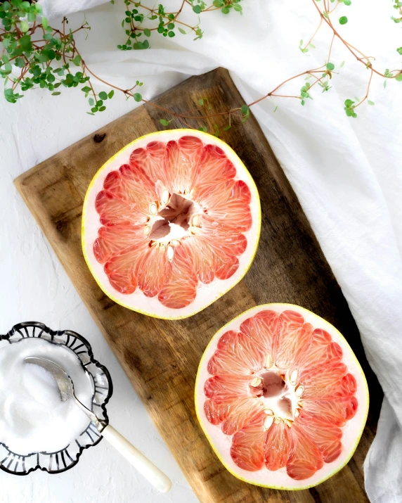 a couple of pieces of watermelon are laying on a  board