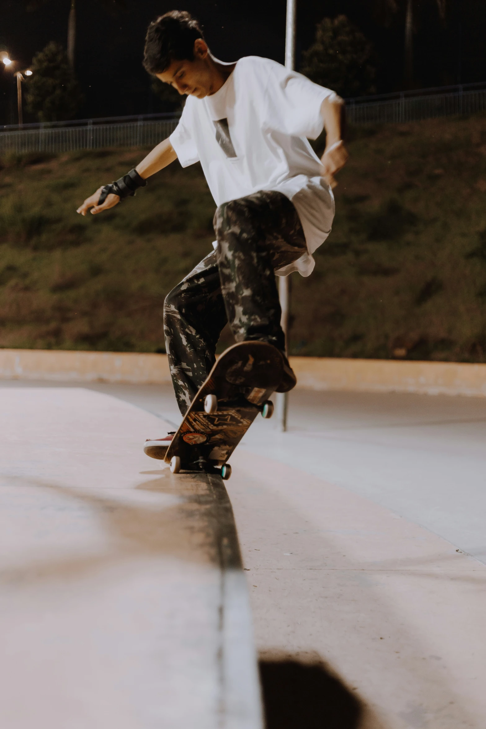 a young man riding on top of a skateboard