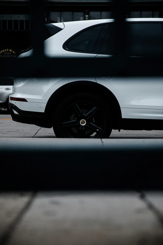 a close up of the front wheel of a parked car