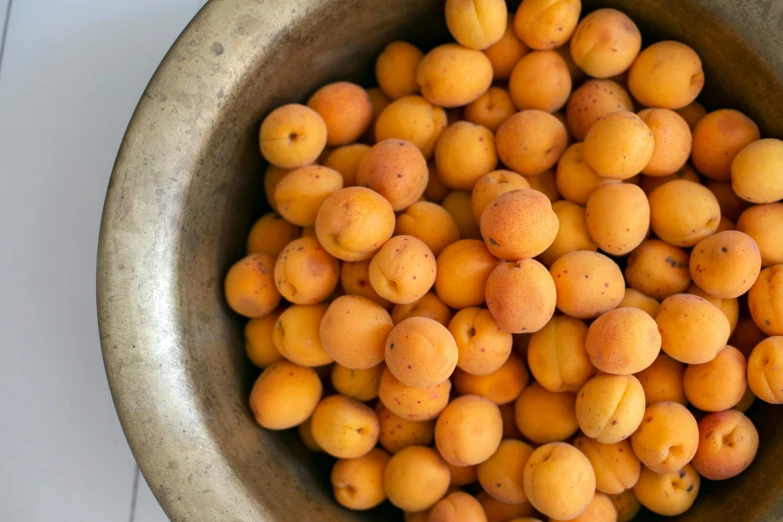 apricots in a large bowl are ready to be baked