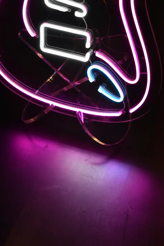 a neon sign with the letter s in it