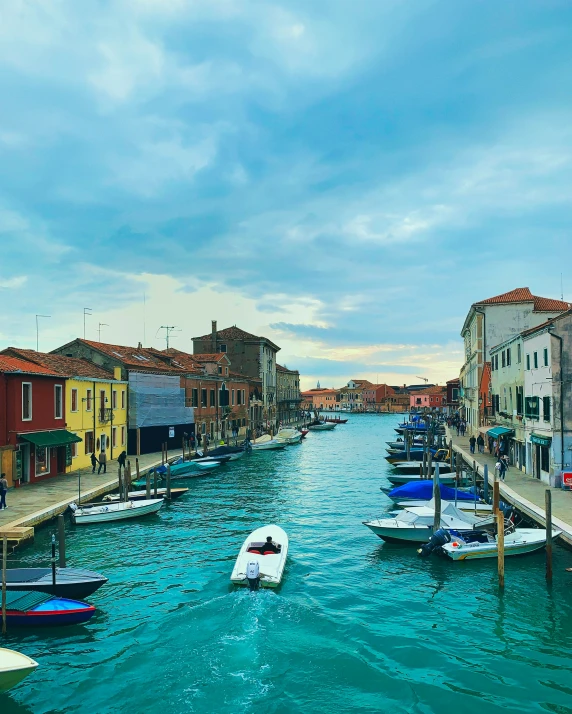 an image of a canal setting near the city