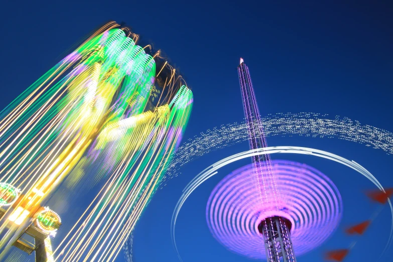 colorful rides show on a clear evening in a park