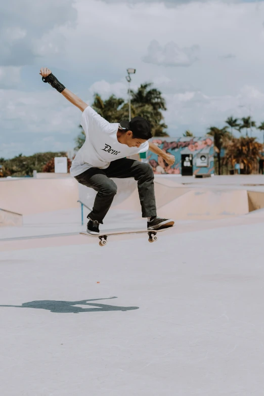 the man is practicing on his skateboard in the city