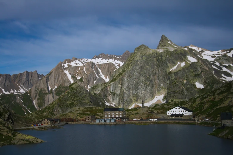 some mountain range in the background with water below