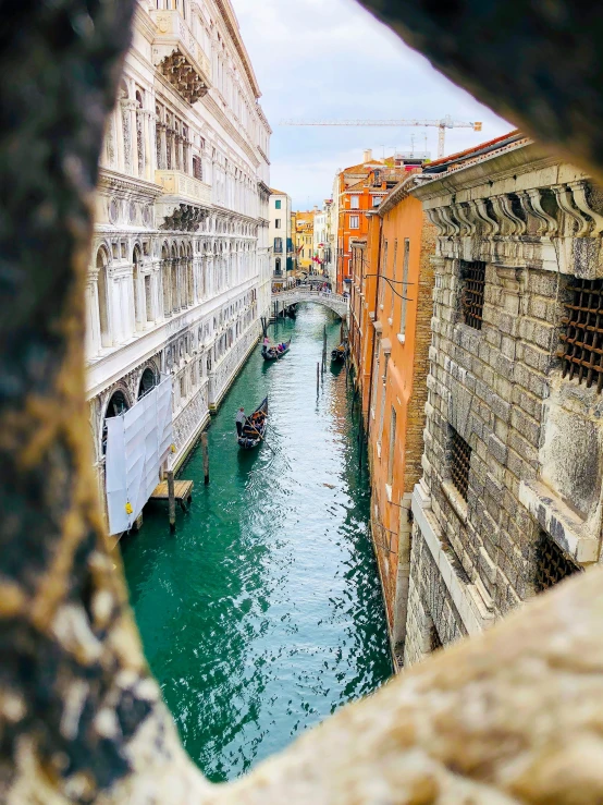 there is some water in this canal between buildings