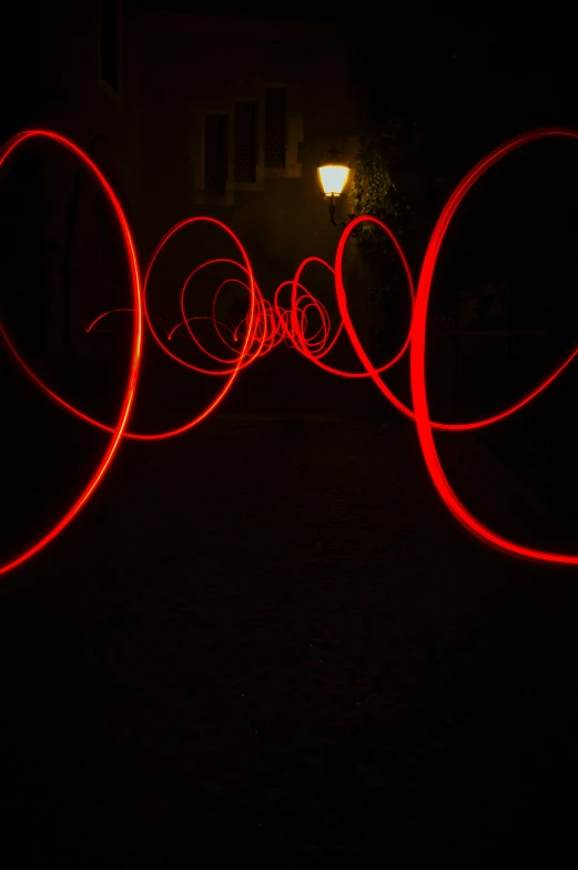 long exposure pography of red lights in the dark