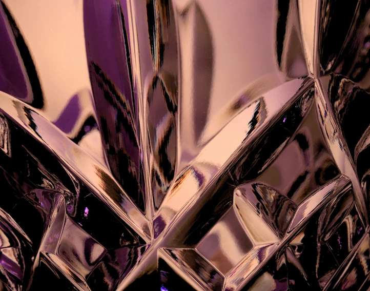 a large pile of silver objects sitting on top of a desk