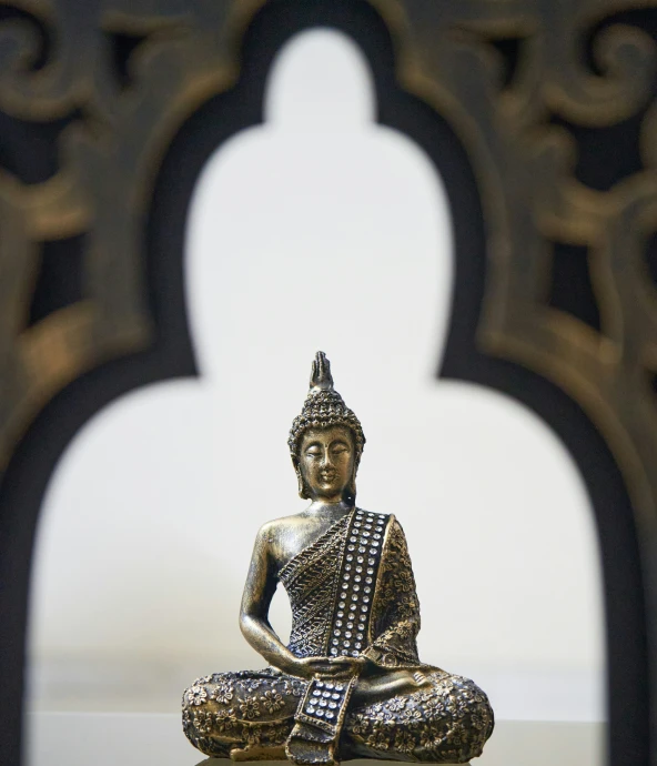 there is a buddha statue made from metal