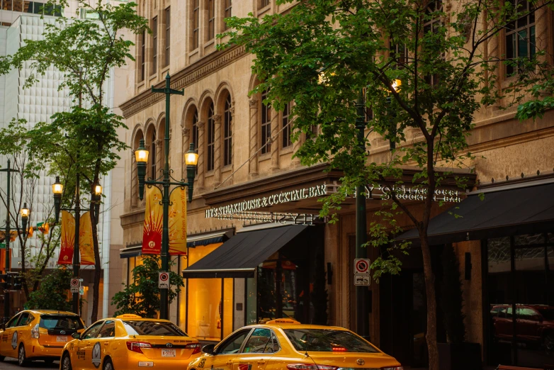 a row of taxis parked on the side of a street