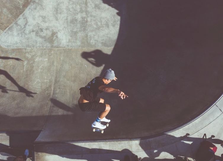 a person riding a skateboard on the edge of a wall