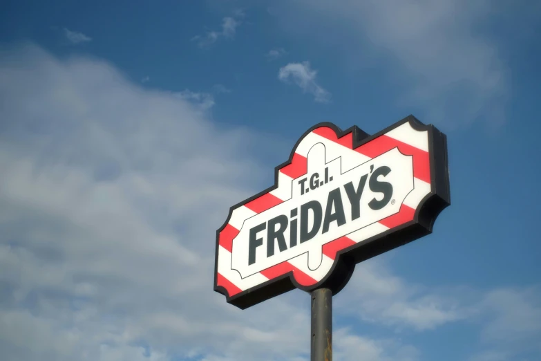 a street sign with the words tcl friday's on it