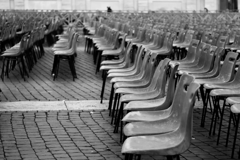 black and white pograph of many rows of chairs