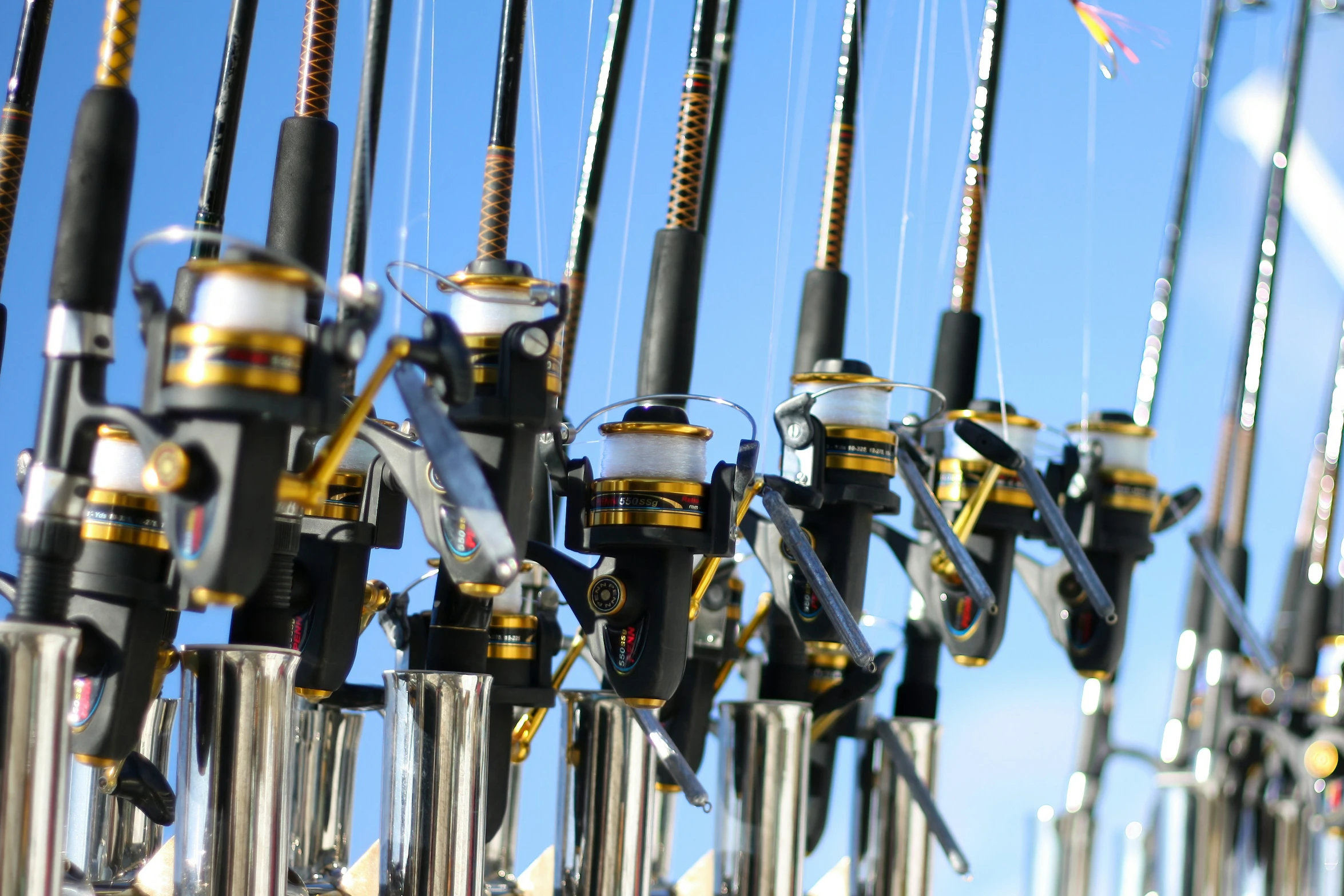 fishing rods connected to each other under blue skies
