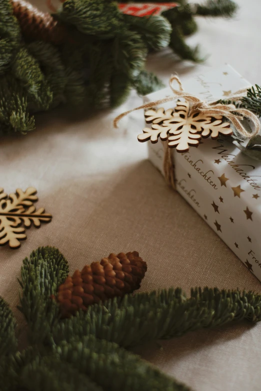 two boxes on a table with some christmas decorations