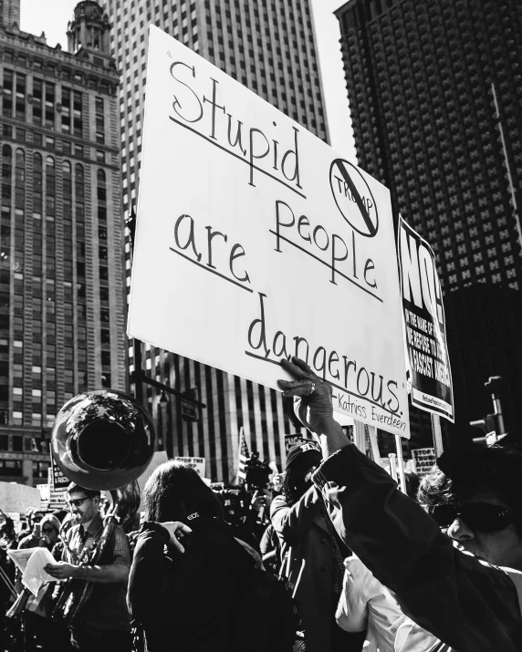 many protesters rally against the new york city bill in a black and white po