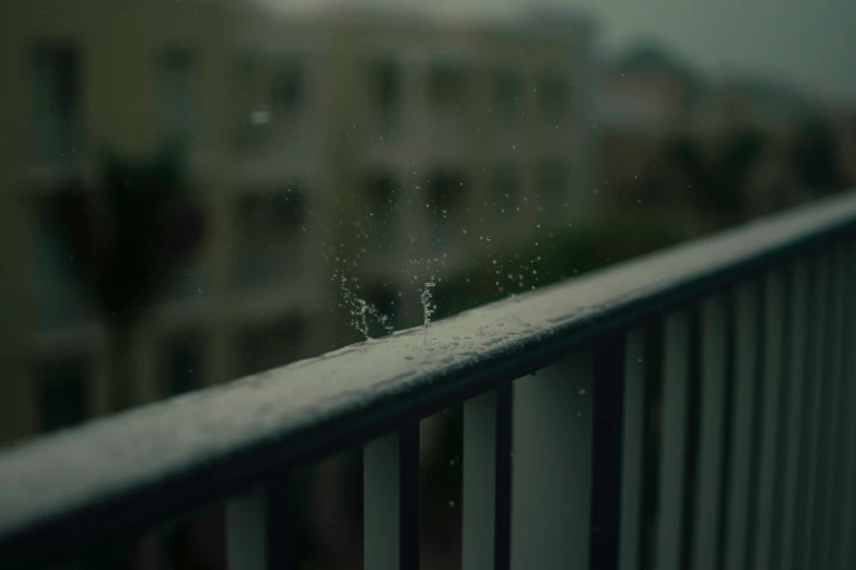 this is a view of a window with some rain falling off it