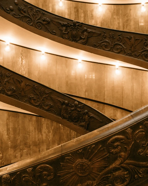 an artistic image of a curved railing and lights in a building