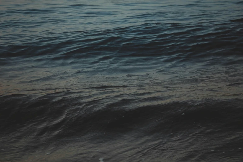 ocean waves in motion on an empty beach