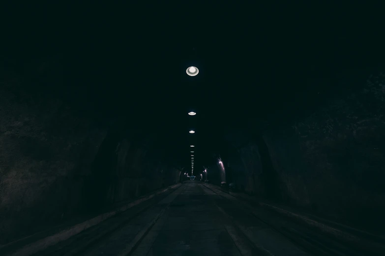 a tunnel with a clock on it and no people