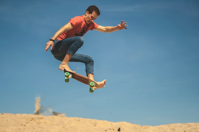 a man that is jumping in the air on a skateboard