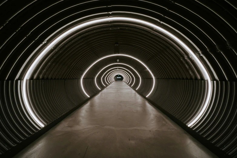 an underground tunnel with lights on it