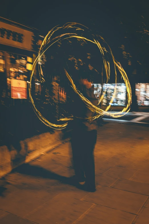 a woman with yellow hair stands on the sidewalk