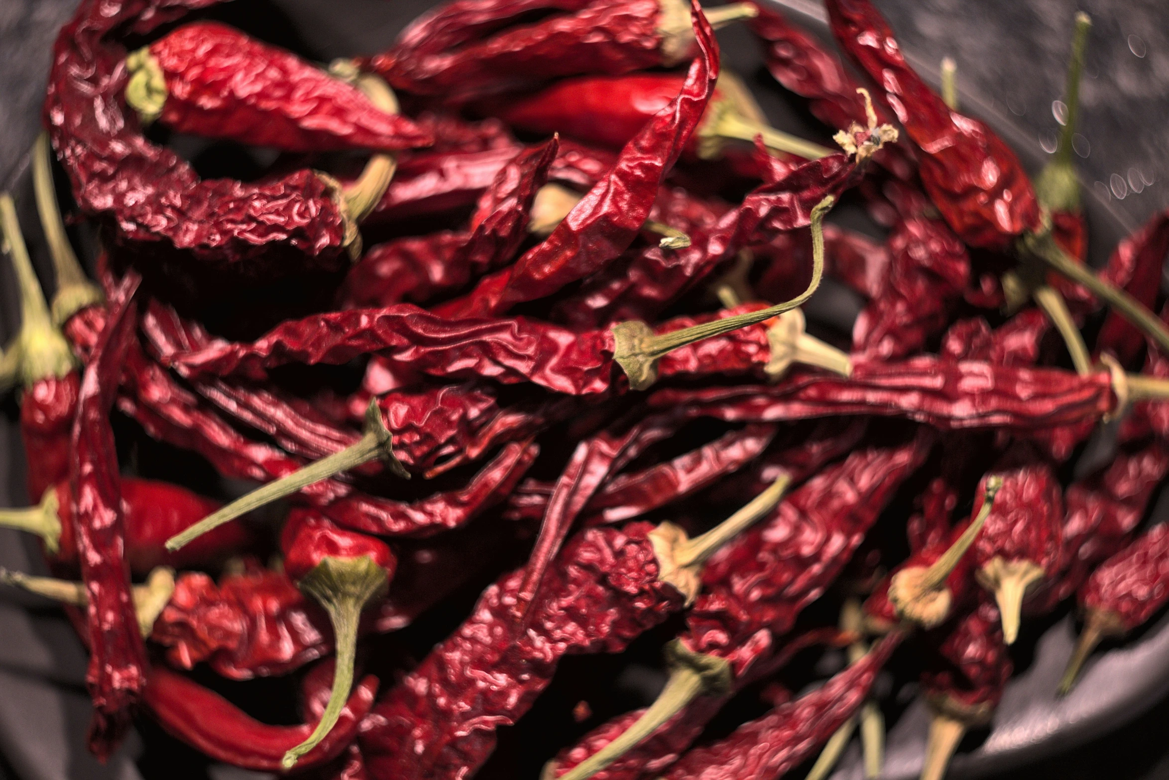 pile of red dried peppers on a plate