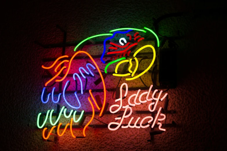 neon signs advertise a variety of drinks