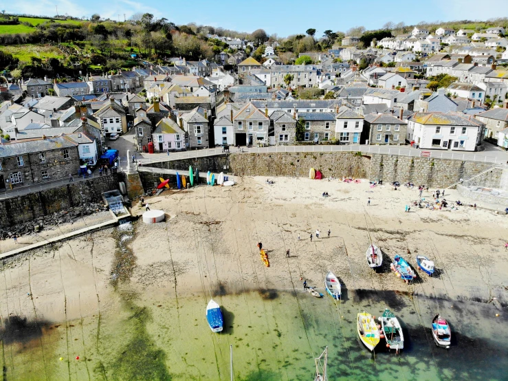 a group of boats parked on top of a beach