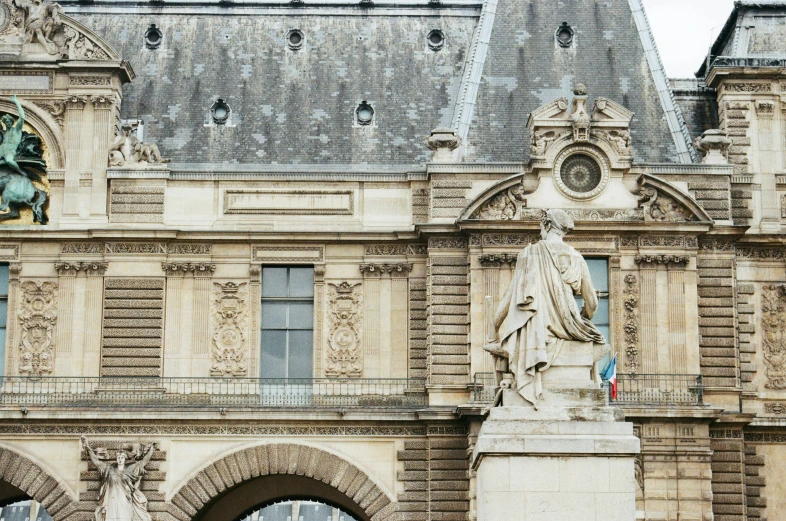 this is a very old building with a statue in front of it