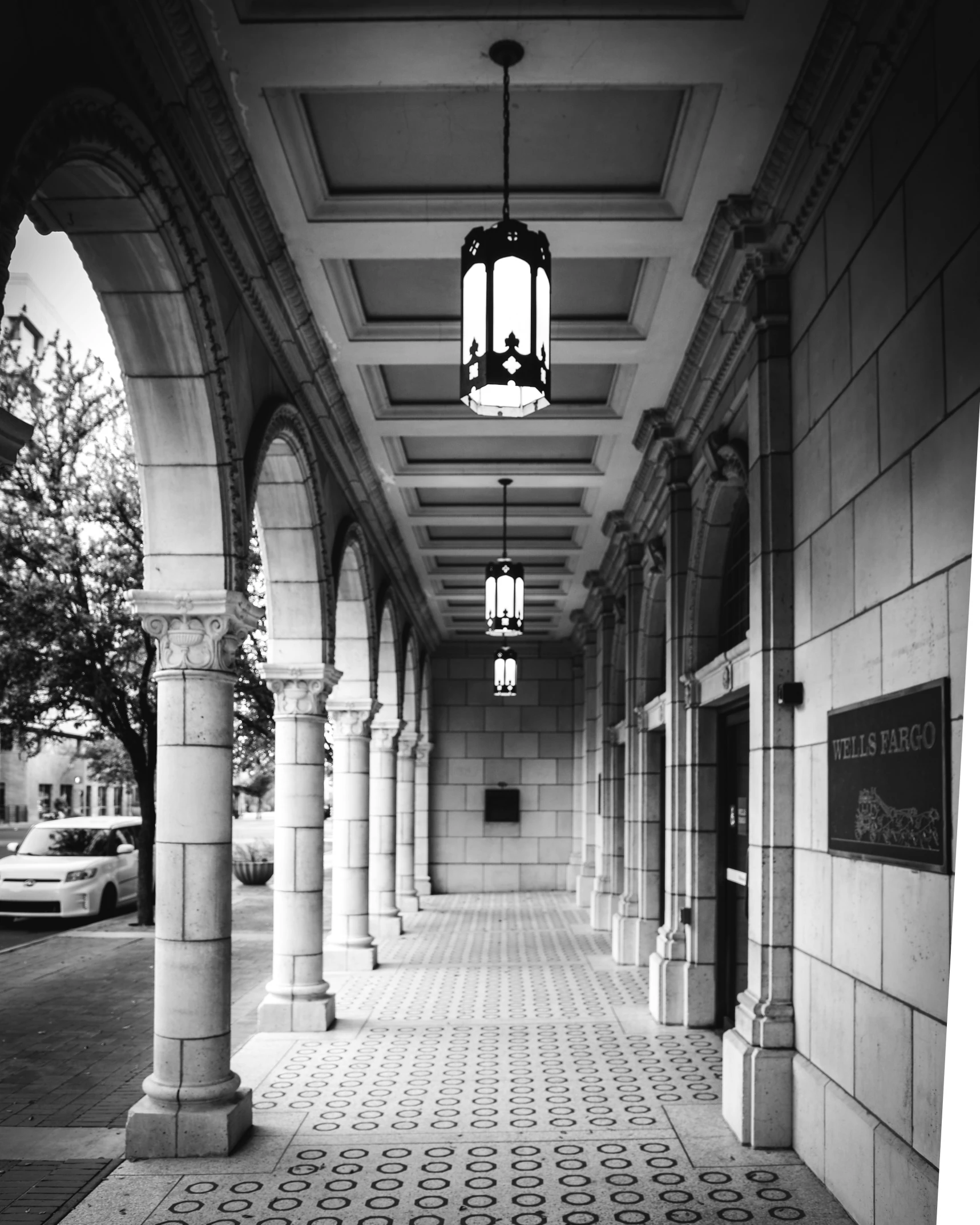 a very long hallway with a hanging light above it