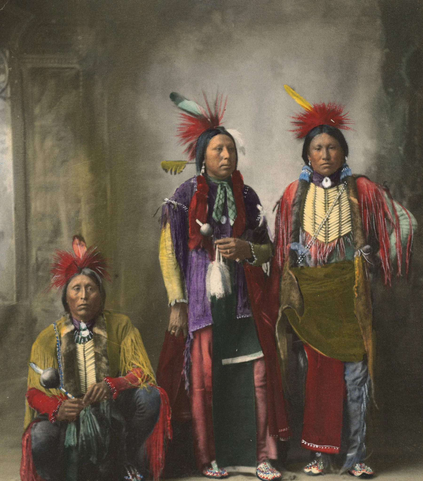 three indian men with traditional hats and clothing