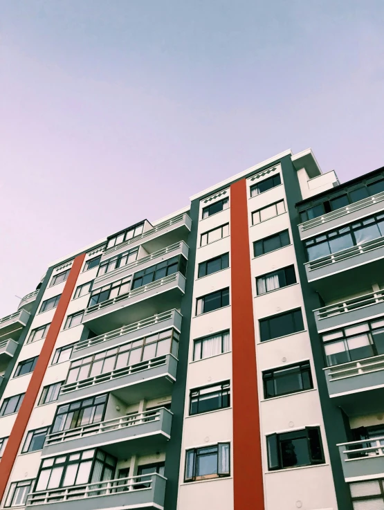 a multi story apartment building with balconies and windows