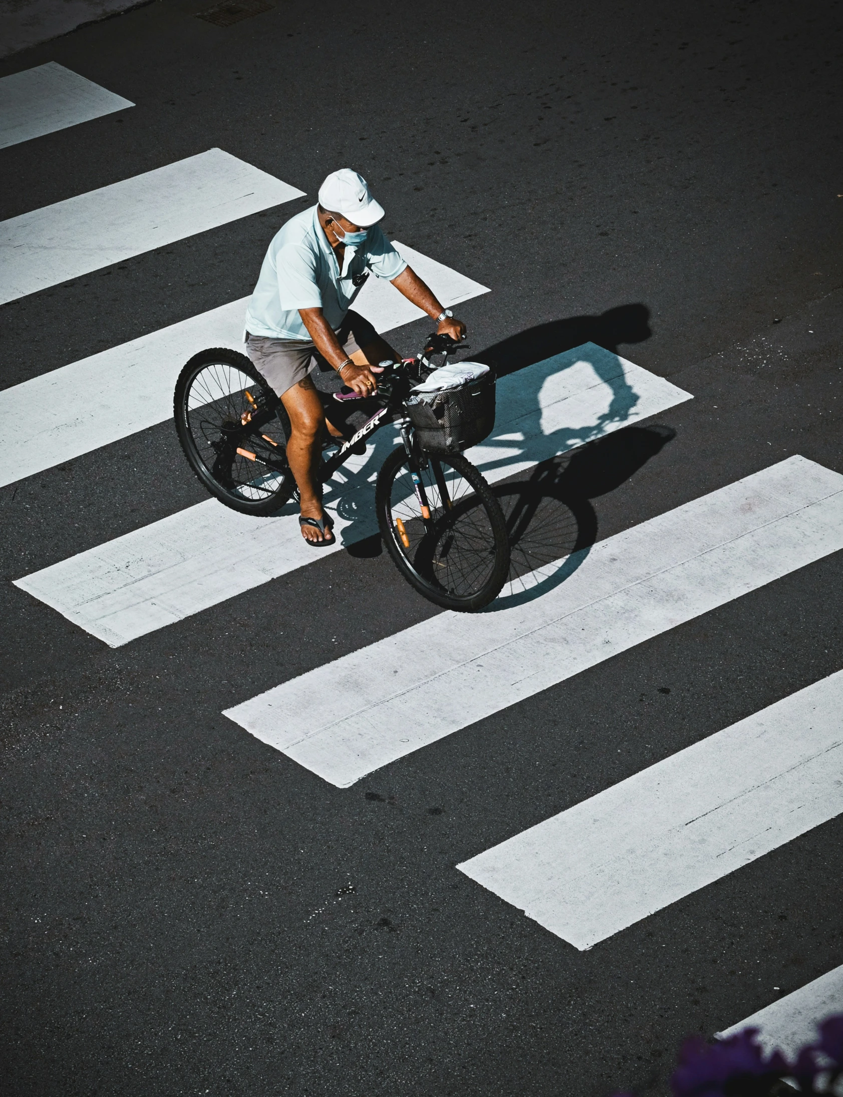 a man riding a bike down a street