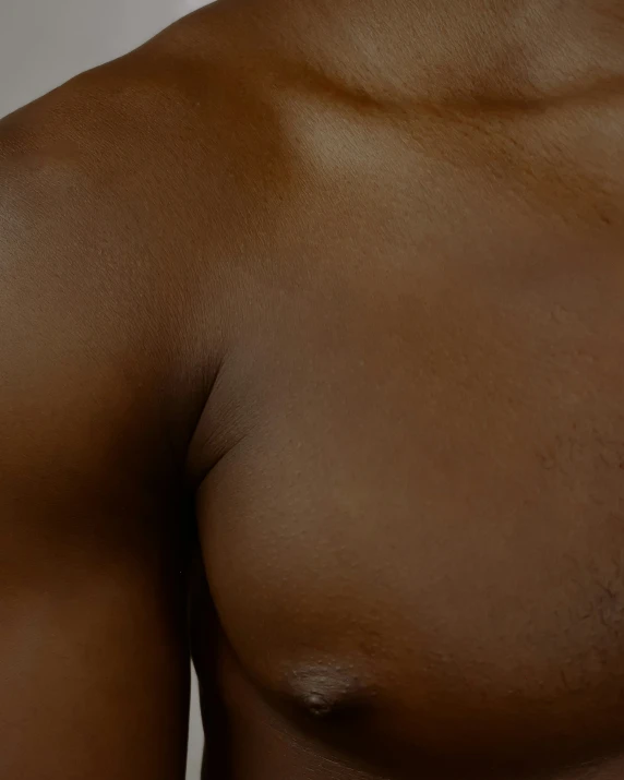 a closeup of an almost  man without a shirt