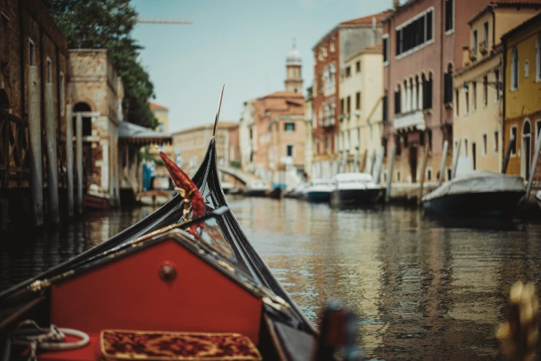 a boat is parked in a narrow canal