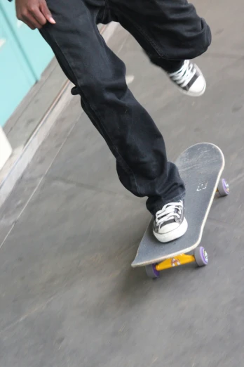 someone riding on their skateboard with no wheels