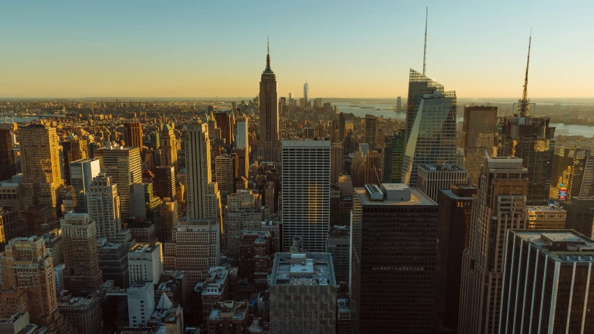 a view of new york city with the empire building and other skyscrs