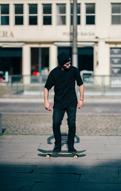 the man is balancing himself on his skateboard