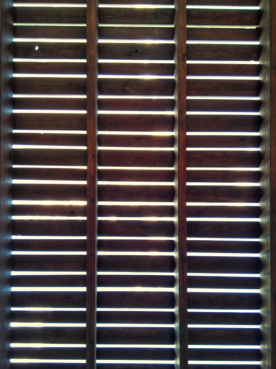 an open window with several different wood shades