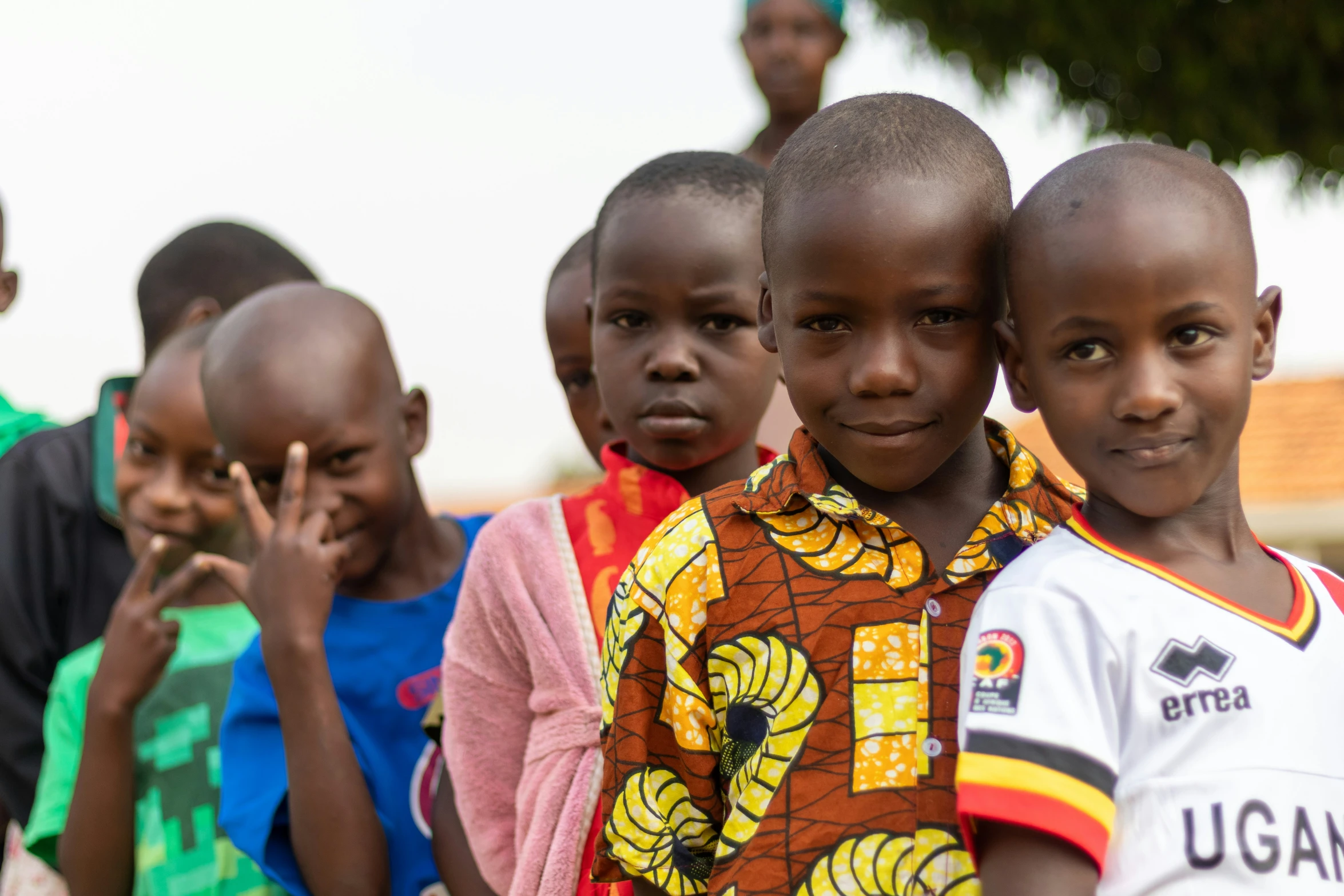 children are standing and posing for the camera