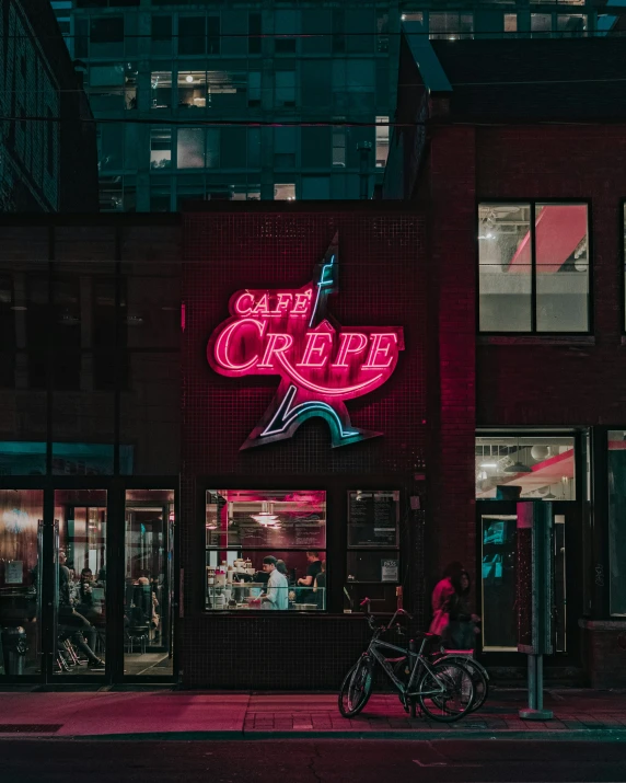 neon sign on side of restaurant saying surf break