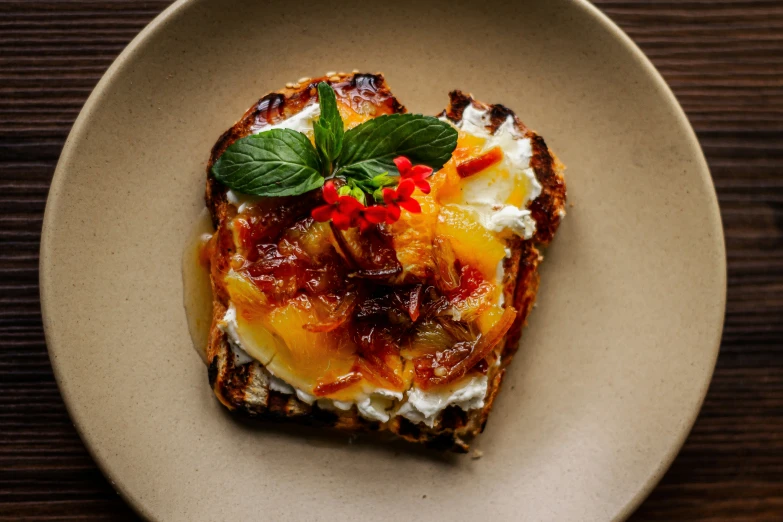 a meal in a white plate on a wooden table